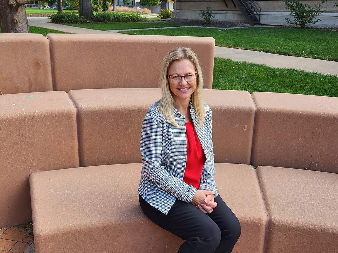 Kyla Gorji, director of the Employee Assistance Program, sits on campus. Gorji is a 15-year honoree at this year's Celebration of Service event.