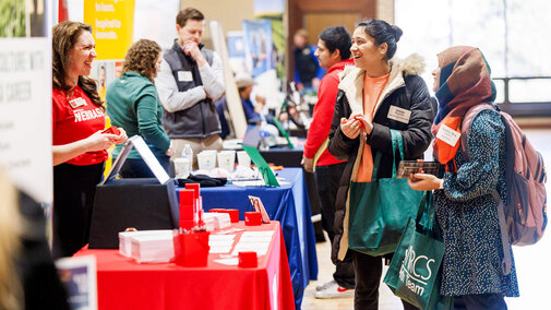 Students talking with employers at East Campus Career Fair